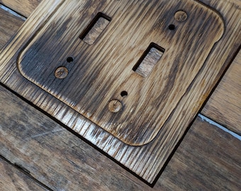 Placca per interruttore della luce in legno bruciato