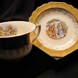 22 Karat Gold Warranted Cup and Saucer Set