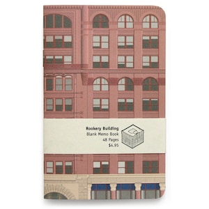 May include: A pink and gray memo book with a vintage illustration of the Rookery Building in Chicago. The cover text reads "Rookery Building Blank Memo Book 48 Pages $4.95".