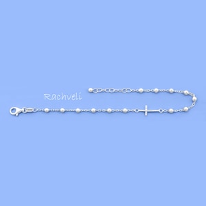 Armband i sterlingsilver med rosenkransmotiv i sidled, religiös gåva till kvinna.