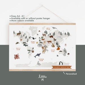 May include: A white world map with a gray background and illustrations of animals from different continents. The map includes the names of the oceans and continents. The text "Caleb's World Map" is at the bottom of the map. The map is framed with a light brown frame.