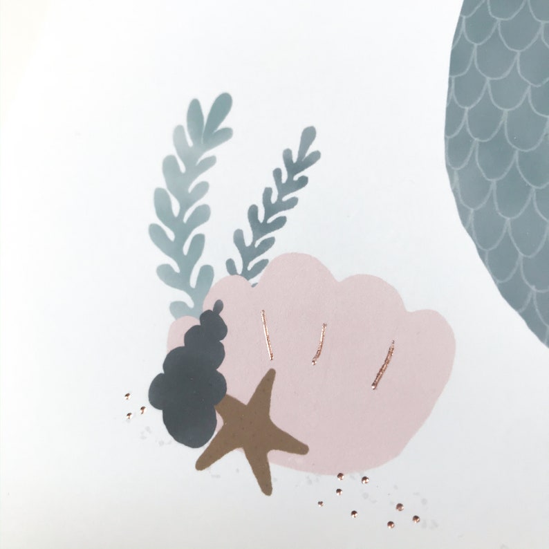 May include: A pink seashell with a gold starfish and a grey seashell on a white background with gold glitter.