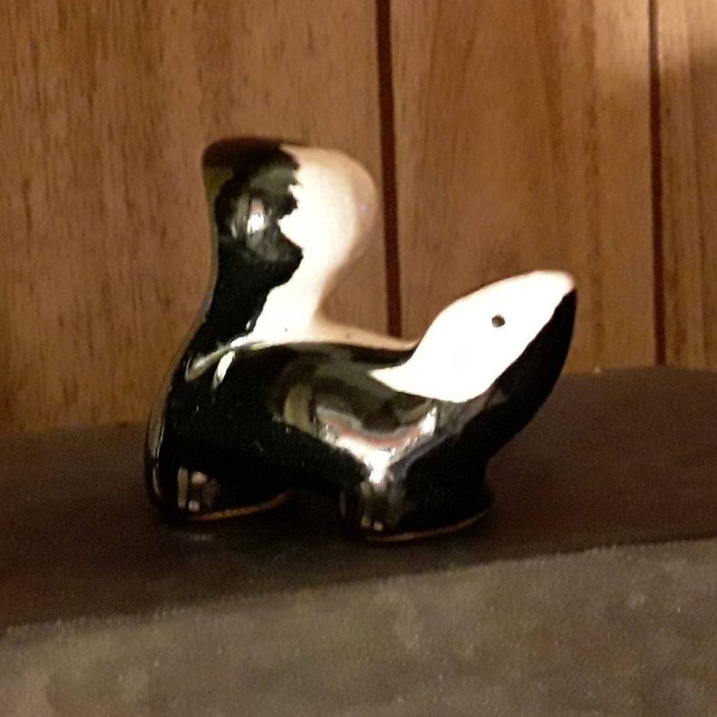 Vintage miniature ceramic skunk