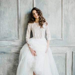 Elbow sleeve wedding dress with layered skirt