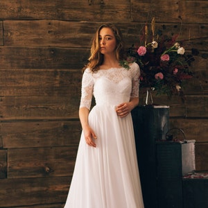 Vintage inspired open back wedding dress with sheer lace sleeve
