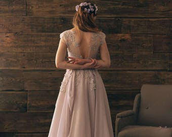 Lavender illusion neckline wedding dress with lace appliques floating down the bodice