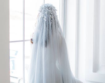 Light blue two tier cathedral veil with hand-sewn textile headpiece and petals with crystals