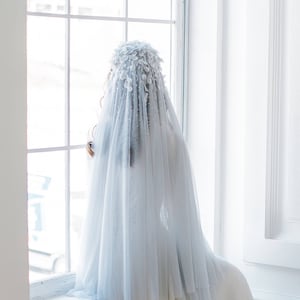 Light blue two tier cathedral veil with hand-sewn textile headpiece and petals with crystals