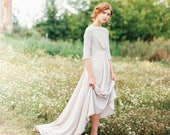 Nude cotton elbow sleeve wedding dress with draped high-neck bodice