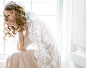 Off-white scalloped edge wedding veil with hand-sewn textile headpiece