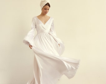 Bohemian white silk wedding dress with bouffant sleeves and open v-neck bodice