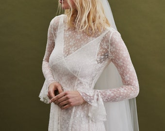 Vintage inspired lace wedding dress with flutter cuff long sleeve bodice