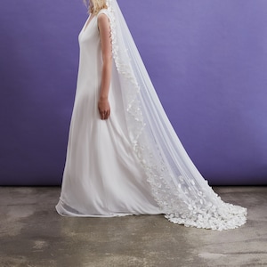 Off-white tulle wedding veil with hand-sewn textile petals