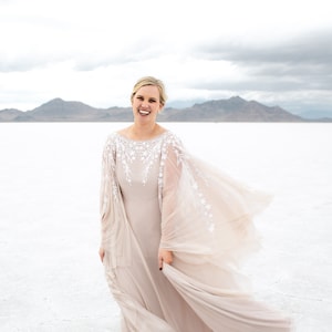 Plus size bohemian wedding dress with bell sleeve and cutout back