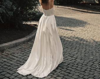 Custom spaghetti strap silk-satin wedding dress with the draped skirt