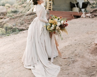 Ball-gown wedding dress with sheer long sleeve embroidered bodice