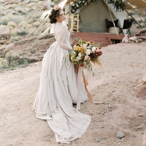 Ball-gown wedding dress with sheer long sleeve embroidered bodice