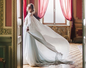 Blue cape wedding gown with hand-cut silk petals and crystal embroidery