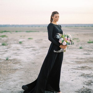 Custom black modest long-sleeve wedding dress with high neck bodice
