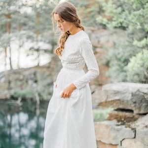 Wedding dress with high-neck bodice and long lace sleeve