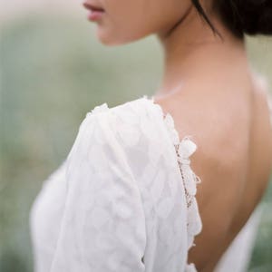 Open-back wedding dress with lace-lined bodice and a flowy skirt image 3