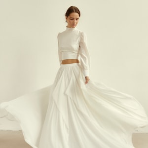 Crop top wedding dress with multilayered chiffon skirt and long sleeve blouse
