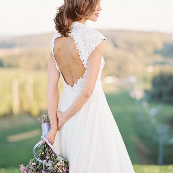 Off-white open back wedding dress with lace bodice