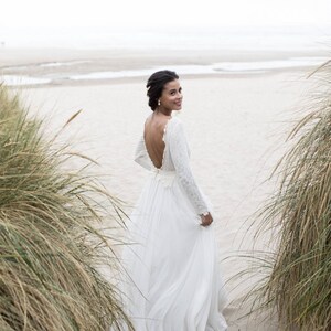 Open-back wedding dress with lace-lined bodice and a flowy skirt image 5