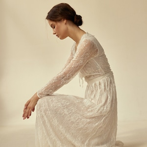 Long sleeve sheath lace wedding dress with crystal embellishment