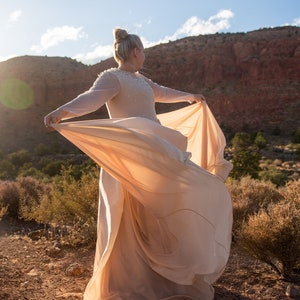Plus size beige wedding dress with sheer long sleeve embroidered bodice