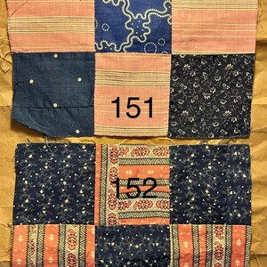 May include: Two patchwork quilt squares with a variety of fabric patterns. The squares feature navy blue, pink, and patterned fabrics. One square has the number "151" and the other has "152" printed on it. The fabrics have floral, striped, and dotted designs.