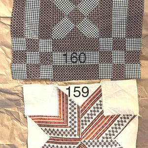 May include: Two antique quilt blocks. The top block is a patchwork design in brown, black, and white gingham. The bottom block features a star design with orange and red accents on a white background. Numbers "160" and "159" are visible.