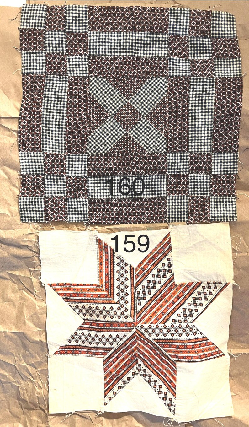 May include: Two antique quilt blocks. The top block is a patchwork design in brown, black, and white gingham. The bottom block features a star design with orange and red accents on a white background. Numbers "160" and "159" are visible.