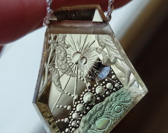 49 carat surrealistic reverse intaglio carved oregon sunstone pendant