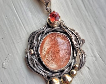 oregon sunstone pendant set in sterling silver with 14k gold accents
