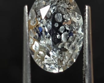 5.5 carat light blue topaz with carved bubbles