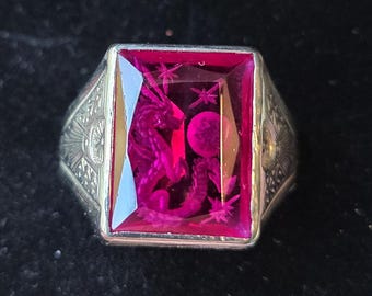 10k white gold ring set with lab created ruby reverse intaglio carved with a dragon size 10.5