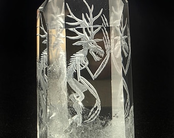 wendigo reverse intaglio carved on a polished Brazilian quartz crystal tower