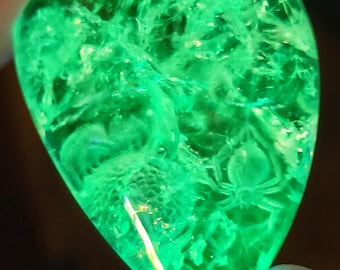 125 carat hyalite opal from Mexico with reverse intaglio spider carving