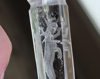 axolotl reverse intaglio carved onto a quartz crystal pendant