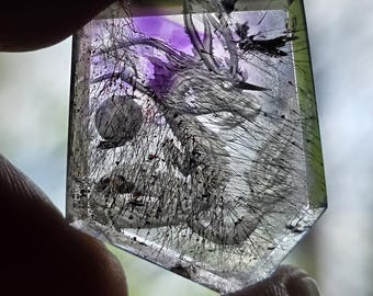 rutilated amethyst carved with a dragon reverse intaglio