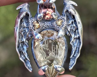 DRAGON'S FLIGHT sterling silver pendant set with a 15.8 carat fantasy carved oregon sunstone, 3.25 carat OR. sunstone and Ca. gold nuggets