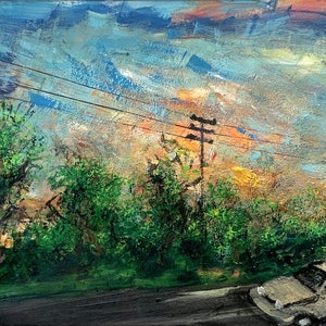 May include: A painting of a car driving on a road with trees and power lines in the background. The sky is a mix of blue, orange, and yellow.