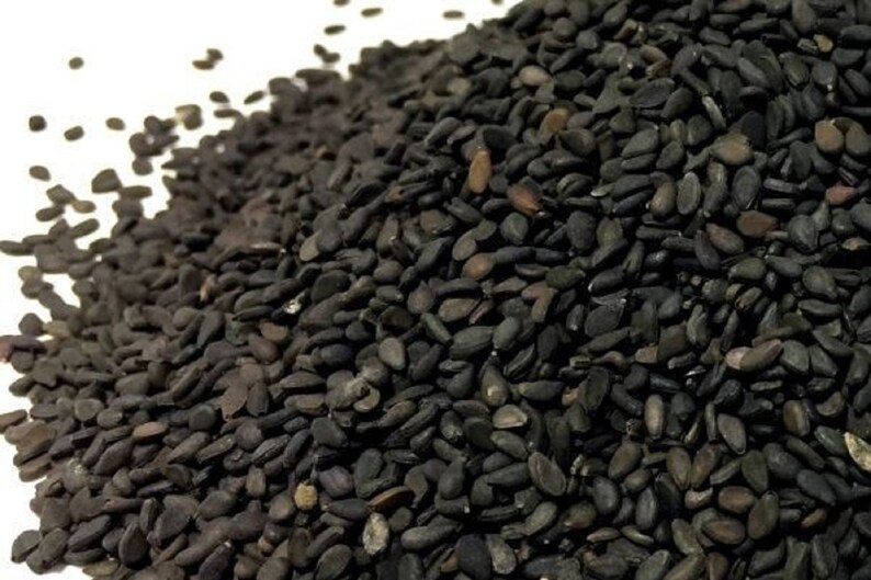 семечки черные. приснились семечки подсолнуха. к чему снятся семечки черные. семечки подсолнечника жареные. черный кунжут сезам.