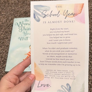 May include: A card with a watercolor background and the text "The School Year is Almost Done!"  The card has a message thanking a teacher for their support and asking them to write a short message inside the book. The card has the text "Love."