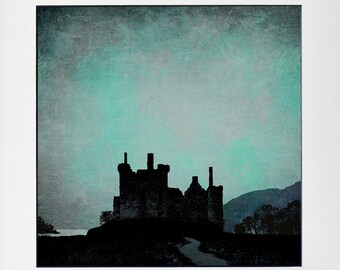 May include: A black and white silhouette of a castle against a blue and green sky. The castle is set against a backdrop of hills and water.
