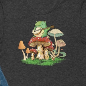 Frog Playing Instrument On Mushroom TShirt, Cottagecore Aesthetic, Nature Lover, Mushroom Tee, Botanical Shirt