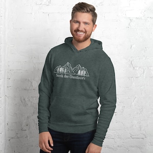 May include: A dark green hooded sweatshirt with a white outline of mountains and trees. The text "Seek the Outdoors" is printed below the image.