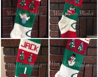 May include: Four knitted Christmas stockings with different designs. Each stocking has a red and white striped cuff, a green body, and a white tip. The stockings are decorated with sequined Christmas trees, an angel, Santa Claus, and a snowman. The stockings are labeled "EL", "JACK", and "West Haven Market".