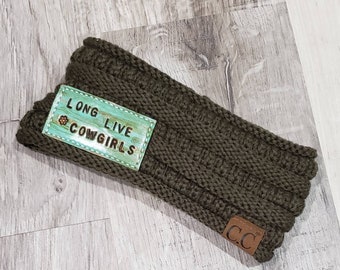 May include: Olive green knitted headband with a light blue patch that says "Long Live Cowgirls" and a brown leather patch that says "C.C."